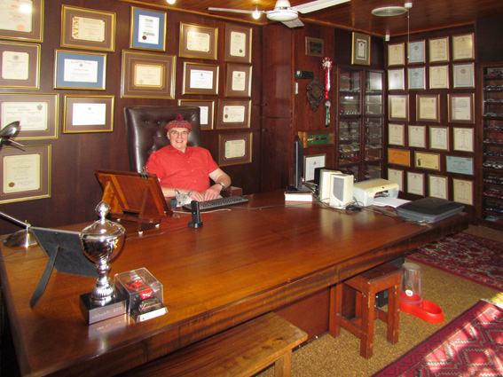 A photo of Leon's study with some of his qualifications in the background